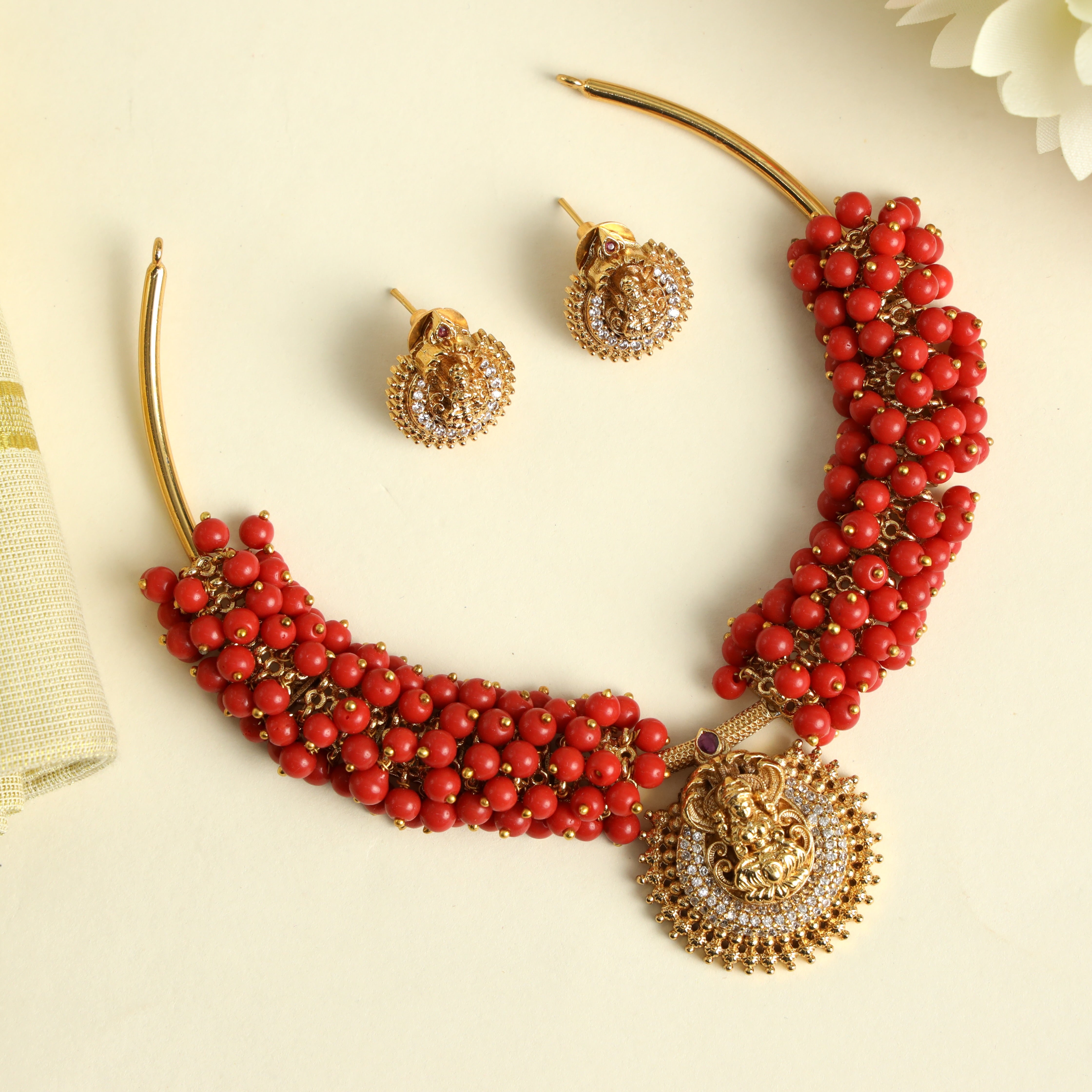 Antique Gold AD Lakshmi Pendant Hasli Set - Coral