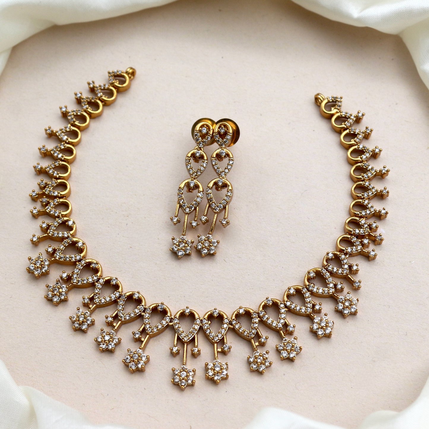 Antique Gold AD Tilak Flower Necklace Set - White