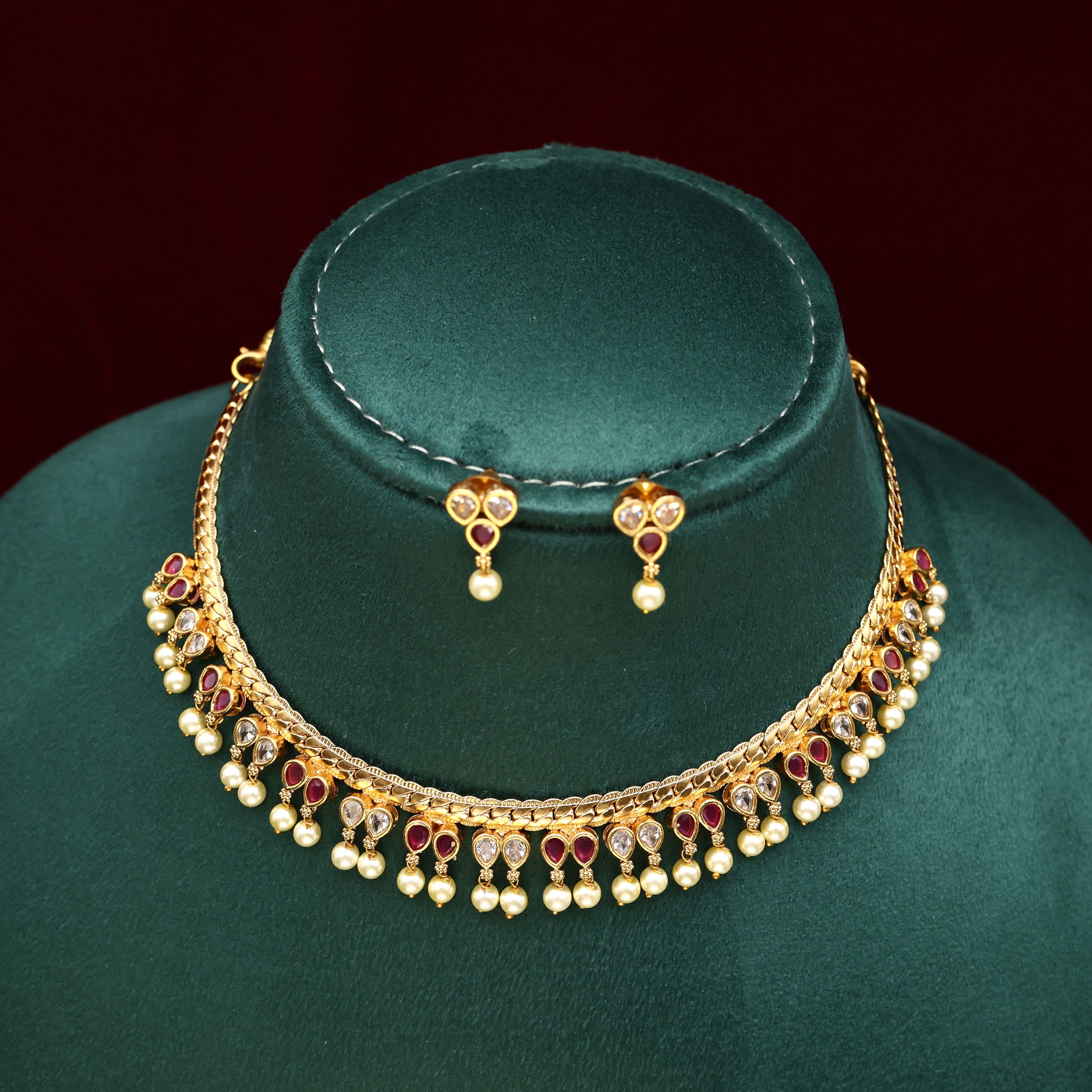GOLD TONE AD THILAK DROPS NECKLACE SET - WHITE & RUBY