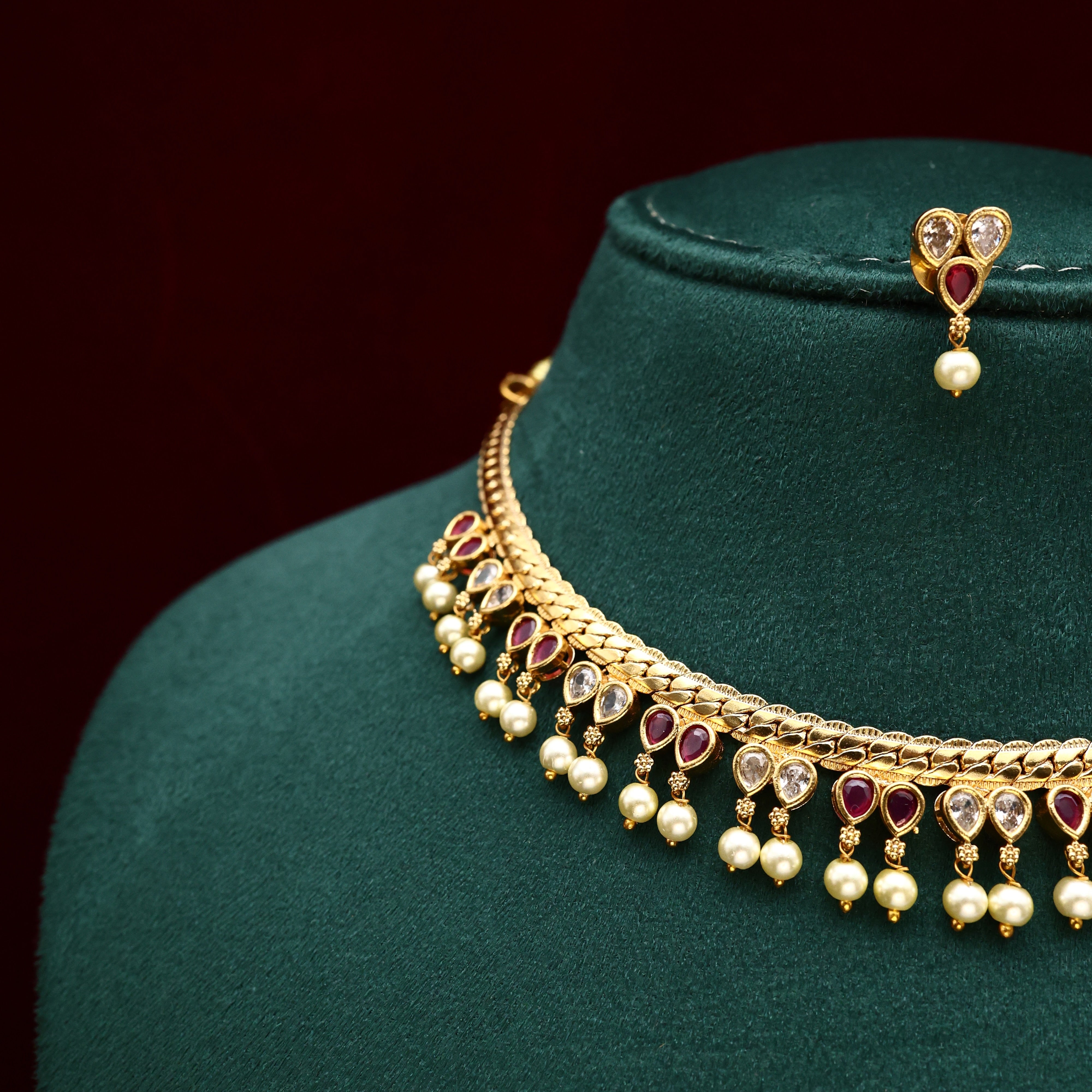 GOLD TONE AD THILAK DROPS NECKLACE SET - WHITE & RUBY