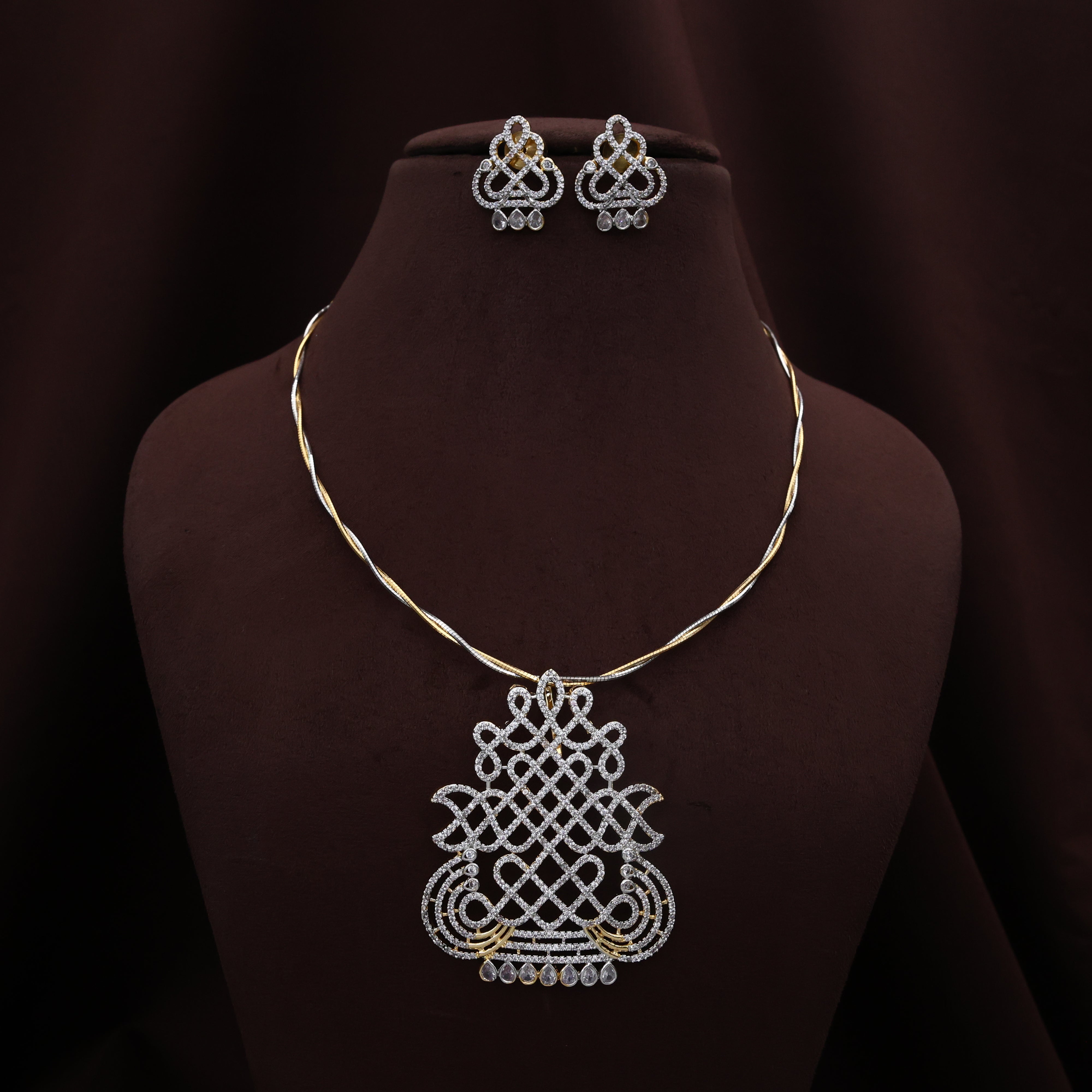 Diamond Look Twisted Two Tone Hasli Kalash Muggulu/Kolam Pendant Set