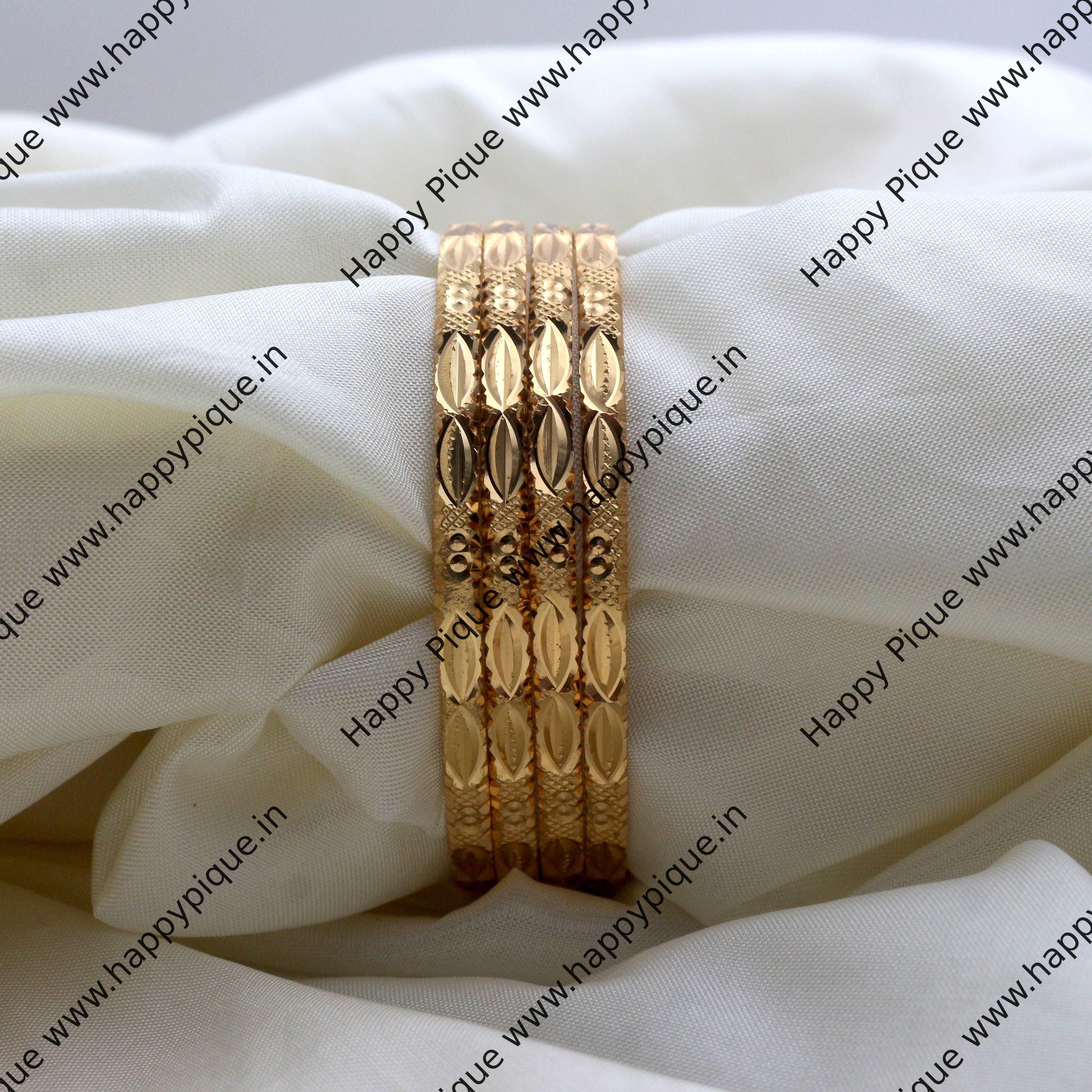 Four bangles set hot sale in gold