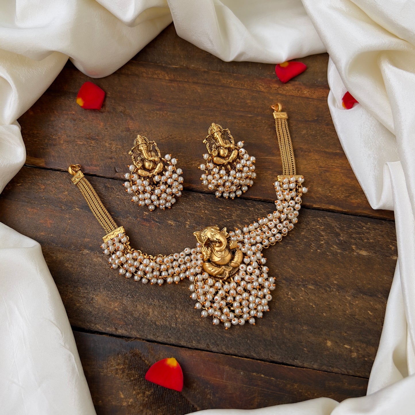 Antique Gold Matte Ganesha Pearl Bunch Choker Set: Exquisite Traditional Beauty