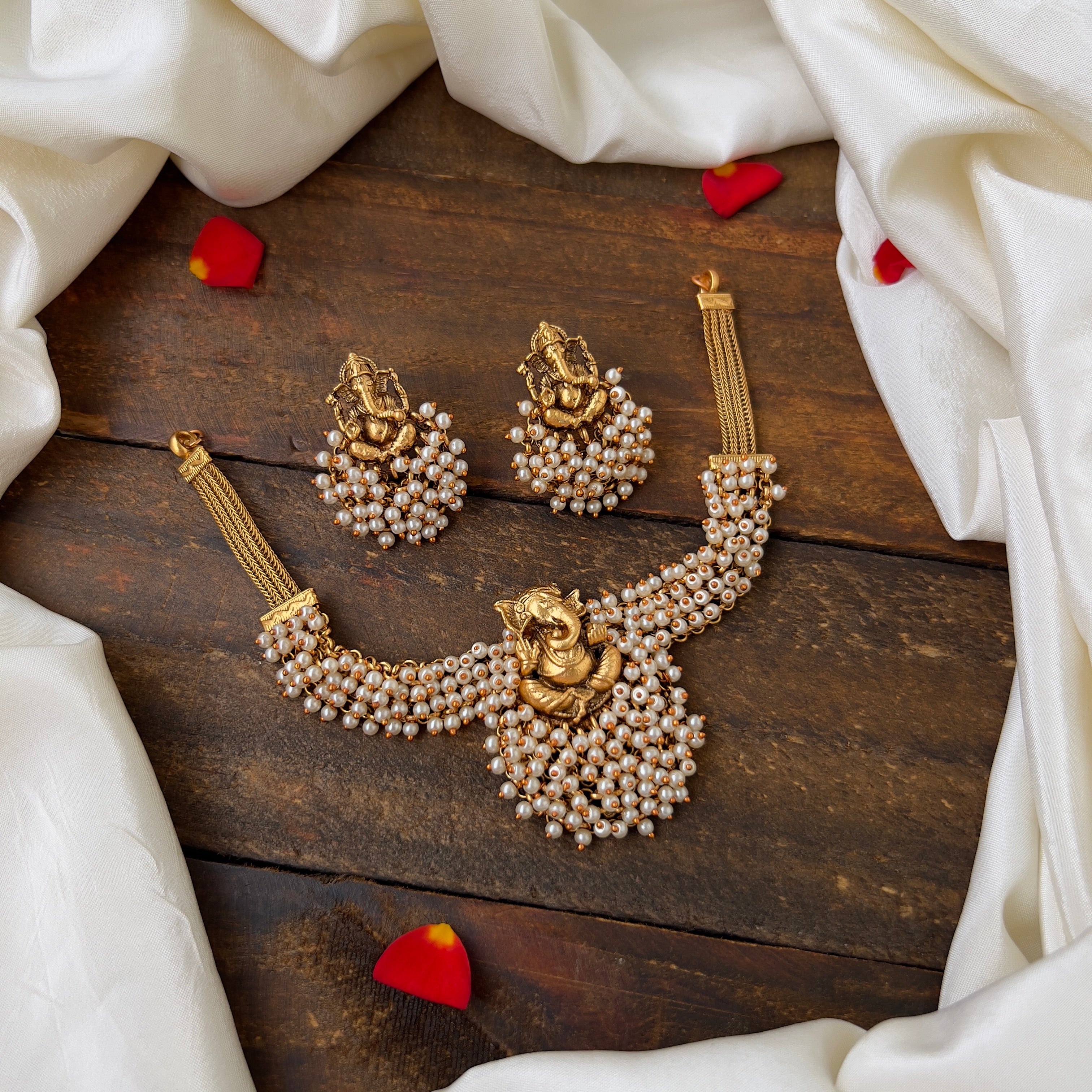 Antique Gold Matte Ganesha Pearl Bunch Choker Set: Exquisite Traditional Beauty