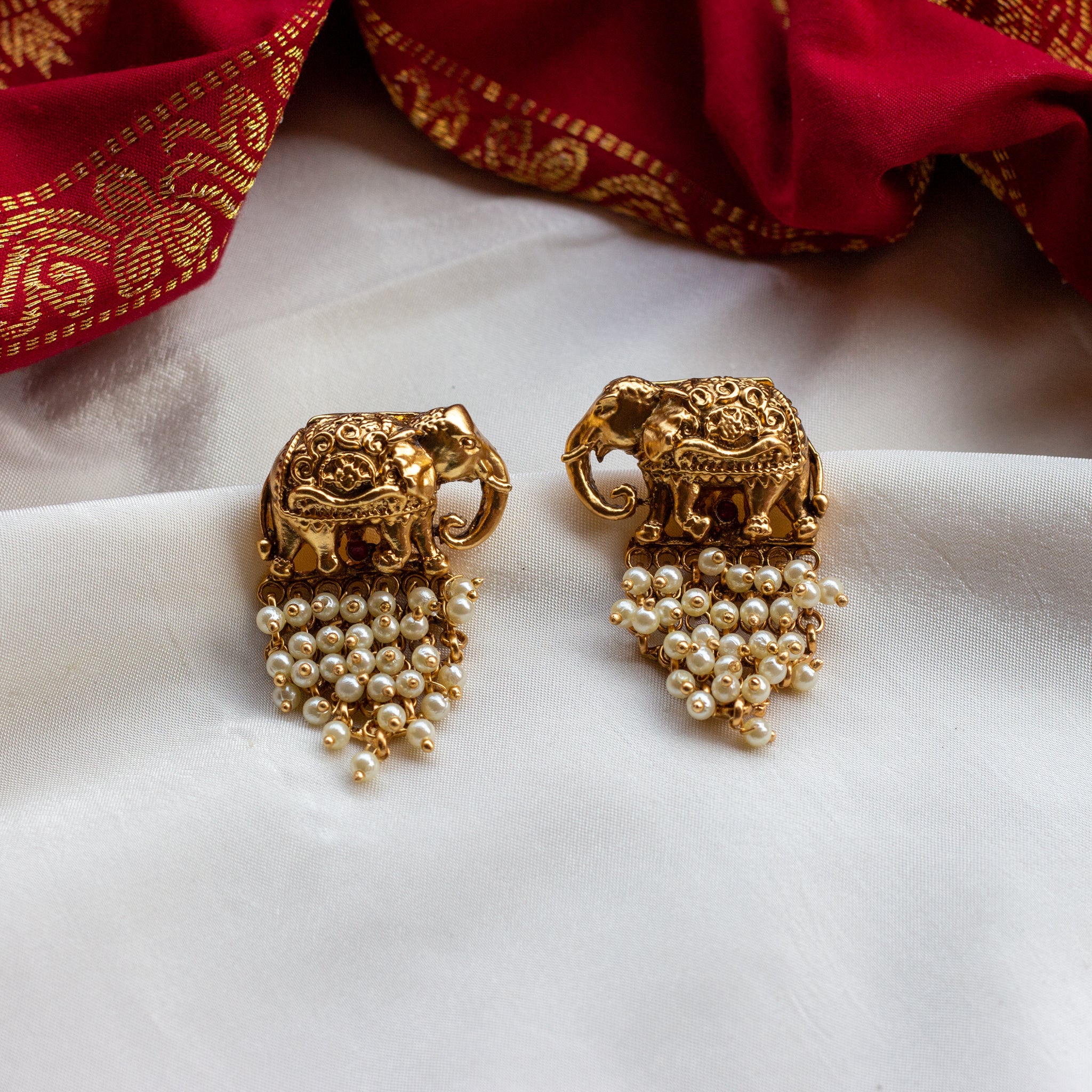 Antique Gold Nagasi Work Haathi Earrings - Pearl