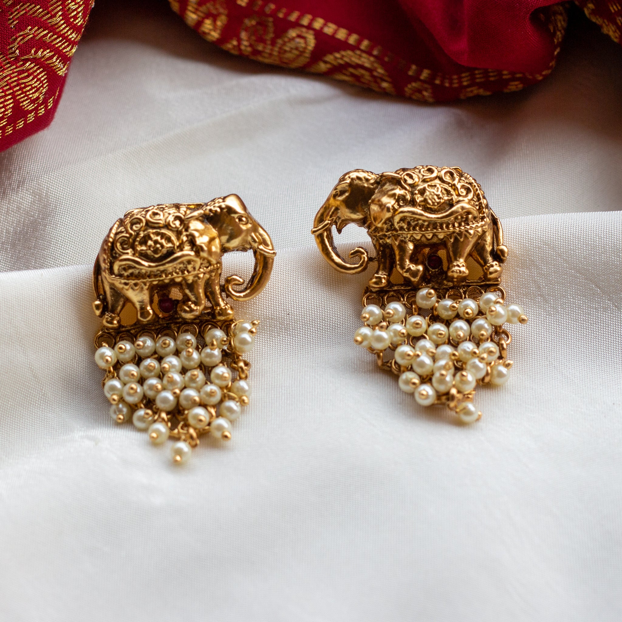 Antique Gold Nagasi Work Haathi Earrings - Pearl