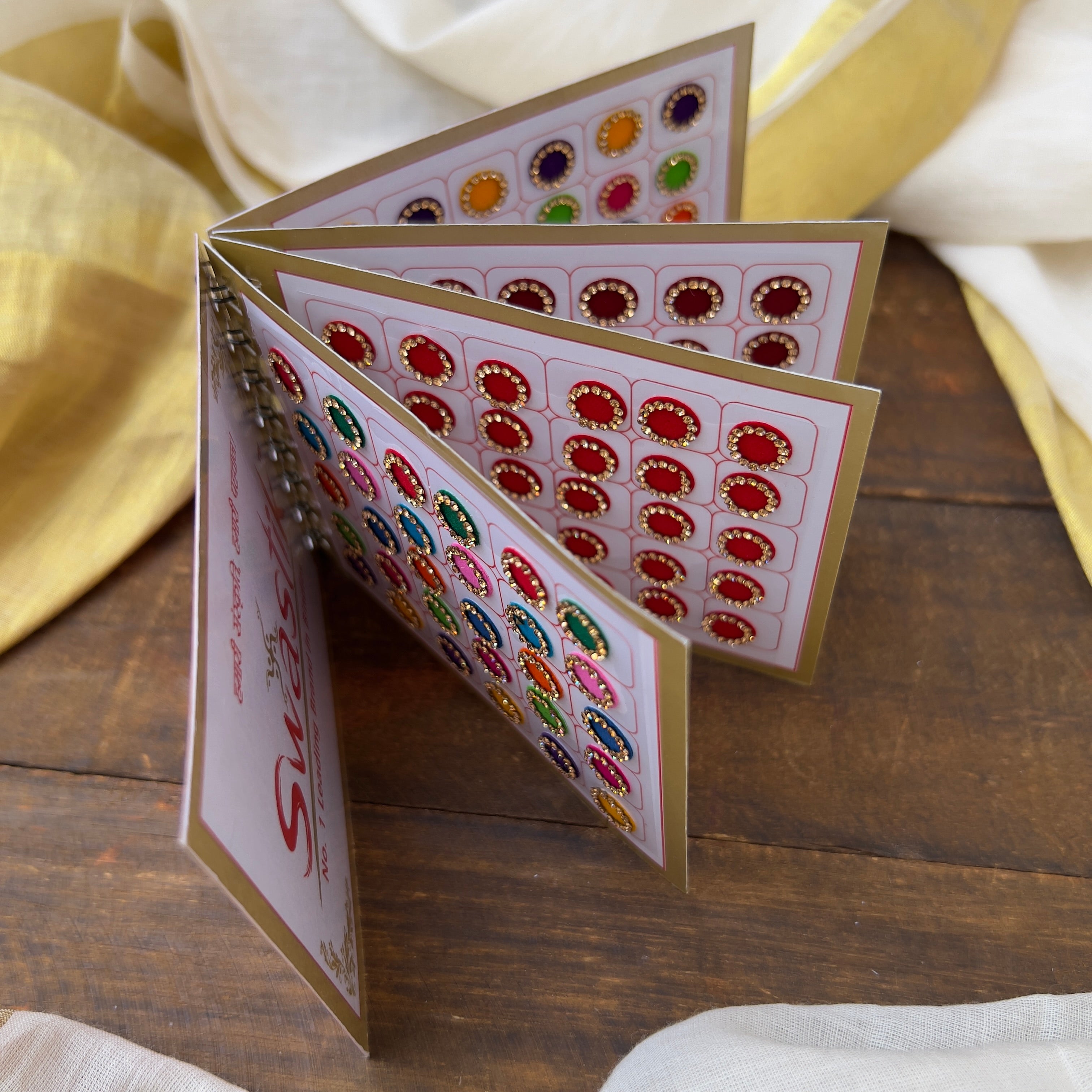 Colour Border Stone Round Bindi Book - Swastik Mini Range - BB013